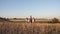 Family of tourists on journey. Dad with two daughters on a camping trip. children and father with backpacks are walking