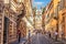 Family of tourists in Via dei Condotti, a street leading to Piazza di Spagna and the Spanish Steps