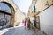 Family of tourists waking in streets Bari, Puglia, South Italy