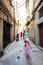 Family of tourists waking in streets Bari, Puglia, South Italy