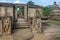 Family of tourists watching around ruined city with 12th century brick buddhist temple, Sri Lanka. Ancient Polonnaruwa.