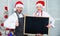 Family traditional menu for christmas dinner. Menu for our family. Man and woman chef santa hat near christmas tree hold