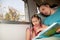 Family on the train reading a book