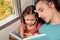 Family on the train reading a book