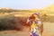 Family travel- little girl with binoculars exploring mountains