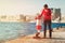 Family travel - mother and little daughter in port