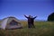 Family traveling and camping, twilight, posing near tent. Beautiful nature - field, forest, stars and moon. Father and son