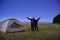 Family traveling and camping, twilight, posing near tent. Beautiful nature - field, forest, stars and moon. Father, son and girl