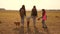 Family travels with the dog across the plains and mountains. mother, daughters and home pets tourists. teamwork of a