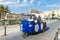 Family on a tricycle in Siracusa, Sicily, Italy