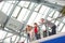 Family with two children on the gallery in the airport