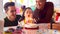 Family With Two Dads Celebrating Daughter\\\'s Birthday At Home With Cake And Party