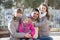 Family with two girls outdoors in sunny fall day