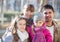 Family with two girls outdoors in sunny fall day