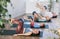 Family with two kids doing pilates with softball