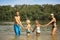 Family and two kids in a lake