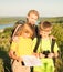 Family with two kids looking at map, family travel. Mother and c