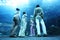 Family in underwater aquarium tunnel