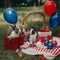 A family of US patriotic rabbits celebrating the Independence Day at picnic. AI generative image.