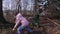 Family using rakes for leaves collecting gardening jobs