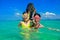 Family vacation, mother and kid snorkeling in sea