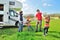 Family vacation, RV camper travel with kids, parents with children on holiday trip in motorhome