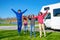 Family vacation, RV travel with kids, happy parents with children have fun on holiday trip in motorhome, camper exterior