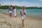 Family on vacation at the seashore of Indian ocean