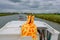 Family vacation, summer holiday travel on barge boat in canal, man in funny kigurumi by steering wheel on river cruise trip