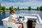 Family vacation, summer holiday travel on barge boat in canal, man by steering wheel on river cruise trip in houseboat