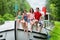 Family vacation, travel on barge boat in canal, happy kids having fun on river cruise trip