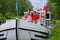 Family vacation, travel on barge boat in canal, parents with kids having fun on river cruise