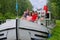 Family vacation, travel on barge boat in canal, parents with kids having fun on river cruise
