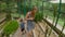 Family visiting the cacti, cactus zone in a botanical garden of Pennang, Malaysia