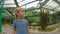 Family visiting the cacti, cactus zone in a botanical garden of Pennang, Malaysia