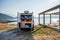 Family waking up in a campervan on the beach