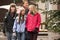 Family Walking Along Town Street In Ski Resort