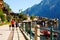 Family walking along waterfront in Hallstadt, Aust