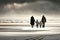 Family walking along in winter beach