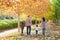 Family walking in an autumn park