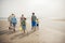 Family Walking on the Beach