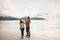 Family walking on beach vacation couple traveling with baby outdoor