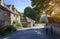 Family walking in Cotswold village, England