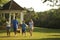 Family walking through park.