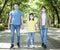 Family walking and wearing mask during coronavirus emergency