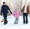 Family walking in a winter park