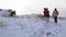 The family walks along the snow-covered hill, a blizzard begins.