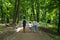 Family walks in the Park. Mom, dad and two children. Happy family