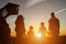 Family watches mesmerizing sunset holding hands in field