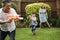 Family Water Fight in the Garden